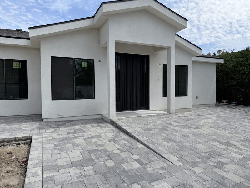 Modern exterior and paved entryway at Aurora Senior Living Louise in Sherwood Forest